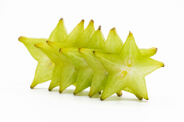 Ripe carambolas or Star fruit slices on white background.