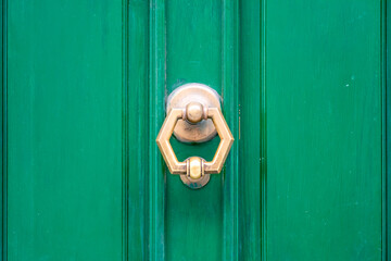 Exagonal Clapper on Green Painted Wood Door