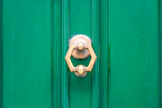 Exagonal Clapper on Green Painted Wood Door