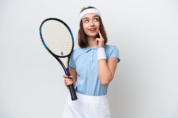 Young Ukrainian tennis player woman isolated on white background thinking an idea while looking up