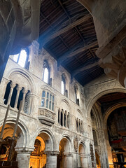 Obraz premium Interior of St. Bartholomew the Great medieval church in City of London. London, England. The Priory Church of St Bartholomew the Great. Anglican church situated at West Smithfield. ceiling, light