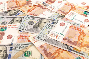 US Dollar and Russian ruble. Money background. Currency exhange. Economic crisis. Rouble dollar cash. Hundred dollar bill and 5000 rubles. Business and finance. Russia and USA