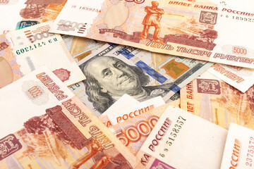 US Dollar and Russian ruble. Money background. Currency exhange. Economic crisis. Rouble dollar cash. Hundred dollar bill and 5000 rubles. Business and finance. Russia and USA