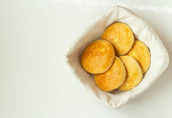 Cookies in a white cotton bag on a white background. View from above.
