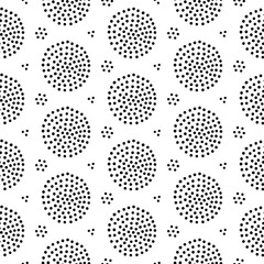 Seamless abstract pattern with funny dotted circles. Hand drawn vector illustration in simple doodle scandinavian style for wallpaper, wrapping paper, textile.