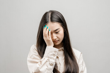 Portrait of a asian girl on a light background. Asian girl in depression