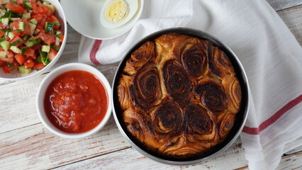 Kubaneh - Yemenite Jewish bread, brioche bread - served on Shabbat morning, served with a crushed tomato dip, hard boiled eggs
