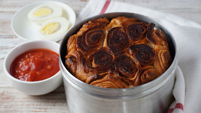 Kubaneh - Yemenite Jewish bread, brioche bread - served on Shabbat morning, served with a crushed tomato dip, hard boiled eggs