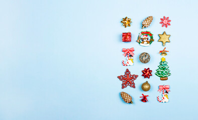 Christmas composition. Christmas gifts, decor, toys on a light blue background. Flat lay, top view. Banner with copy space.