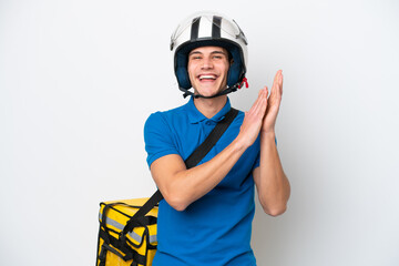 Young caucasian man with thermal backpack isolated on white background applauding after presentation in a conference