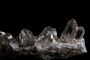 clear quartz crystals on a black background