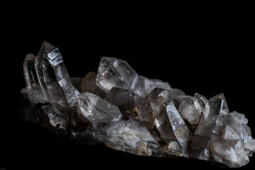 clear quartz crystals on a black background