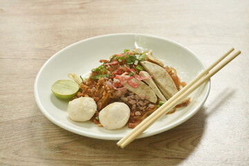 stir fried thin rice noodle with pork meatball dressing dry shrimp in black sweet soy sauce on plate 