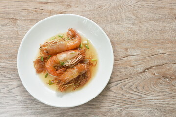 fried river shrimp dressing sweet and sour tamarind sauce on plate