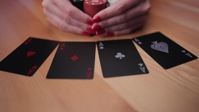 Female person win poker game bet with double double ace cards grab the reward 4K