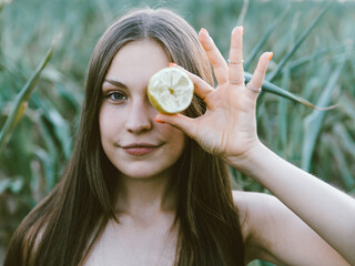 Young woman with lemon