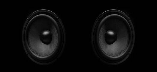 Pair of black speakers close-up on a dark background. - obrazy, fototapety, plakaty