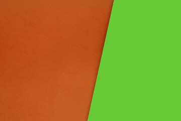 Fototapeta premium Dark vs light abstract Background with plain subtle smooth de saturated green orange colours parted into two