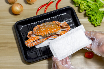absorbent pad with  crab on plastic packaging  in supermarket, Good quality for food store