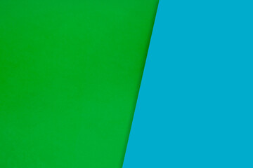 Dark vs light abstract Background with plain subtle smooth de saturated blue green colours parted into two