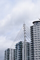 Naklejka premium Looking up at modern buildings with a sky background. Taken in Salford Quays England. 