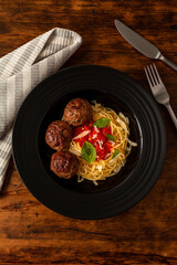 Meatballs with spaghetti in sugo sauce