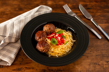 Meatballs with spaghetti in sugo sauce