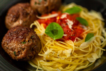 Meatballs with spaghetti in sugo sauce