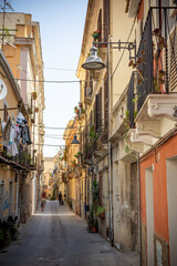 Fototapeta na wymiar Pictoresque Street in the center of Cagliari, in Italy, in a Sunny Day
