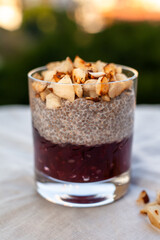 Chia pudding with red fruit jelly and toasted chestnut