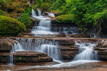 Obraz premium Tad Kinnaree waterfall, Beautiful waterfall in Phu LangKa Nationalpark Nakhon Phanom province, ThaiLand.