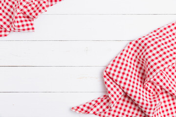 Backdrop for menu of food to restaurants. Red and white fabric tablecloth checkered on wooden white...