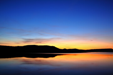 Fototapeta na wymiar morning lake with mountain before sunrise