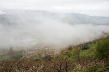 View of a beautiful foggy valley
