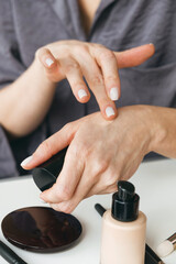 Close up shot hands of a woman applying cream. Women daily routine. Cosmetic care