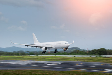 Fototapeta na wymiar blur withe airplane landing on runway 