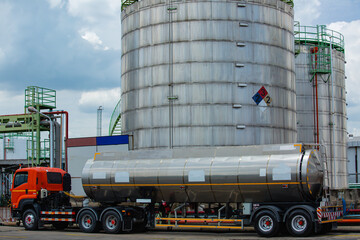 Obraz premium Transportation truck dangerous chemical truck tank stainless is parked