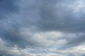 Dark and grey featureless layers of nimbostratus clouds.