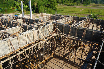 Bonding of reinforcement, making formwork, timbering on construction site.