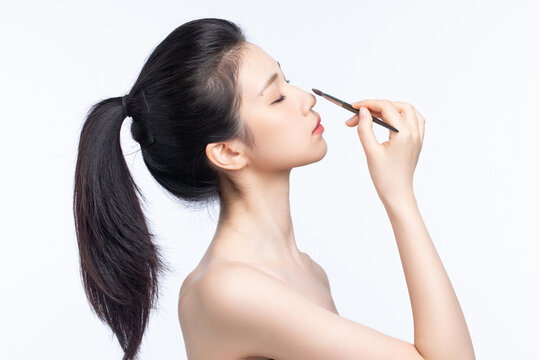 Asian beauty doing makeup