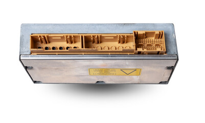 Plastic car engine control unit with metal elements on a white isolated background is the connecting center of various subsystems, units and assemblies. Monitoring the state of the moment. Spare part.
