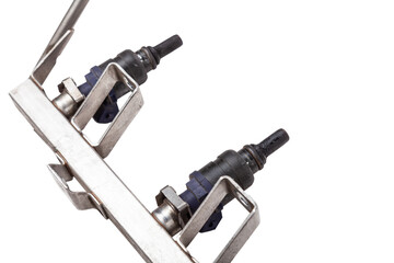 Close-up on a car fuel injector for supplying gasoline to cylinder engine on a white isolated...