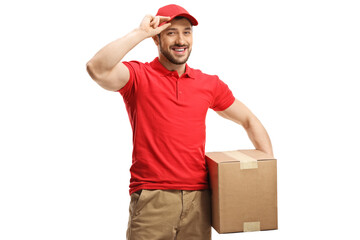 Delivery man with a box smiling and greeting with cap