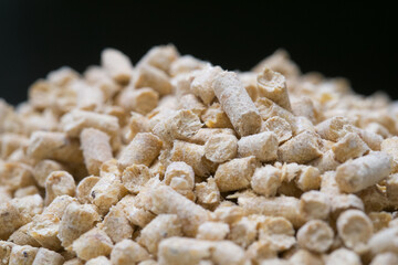 Pine sawdust Heating pellets stacked in the tank. Close up.