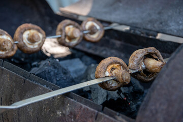 Fried juicy mushrooms on the grill summer picnic