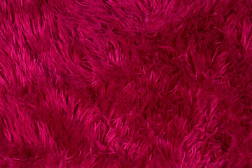 Dark burgundy fur texture with long pile.