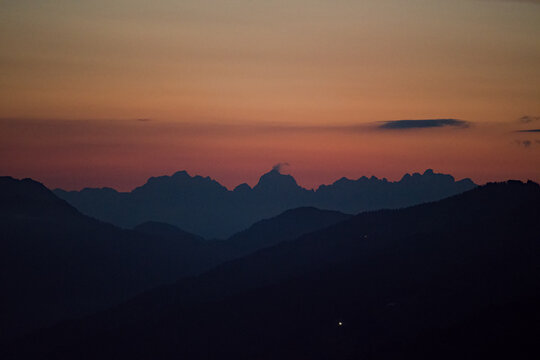 beautiful view of the wilder kaiser in tirol austria at the sunset with red sky