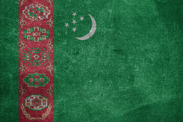 Old leather shabby background in colors of national flag. Turkmenistan