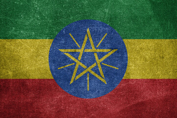 Old leather shabby background in colors of national flag. Ethiopia