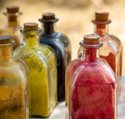 glass bottles with cork stopper with powder colors inside
